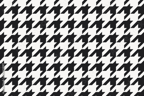 Black and white geometric pattern with repeating shapes and lines in an organized layout across the surface