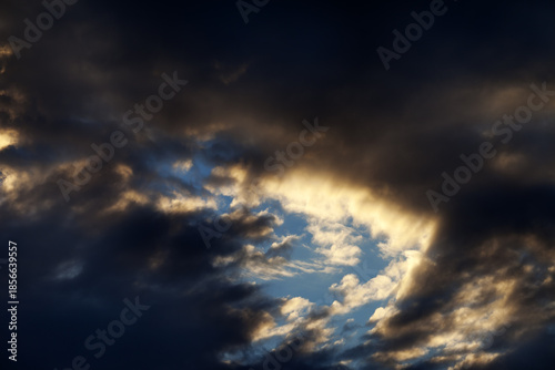 Storm clouds on sunset sky