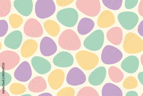 Colorful shapes arranged in a random pattern on a light background during daylight in a creative space