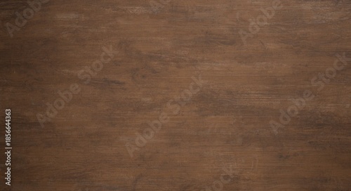 A warm, medium-brown wooden surface with subtle grain patterns and a smooth finish. It's an evenly lit, horizontal plank texture for backgrounds
