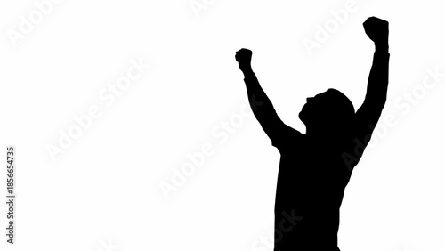 Silhouette of a triumphant person raising arms in celebration.