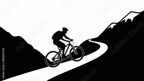 Silhouette of a mountain biker riding on a winding road.