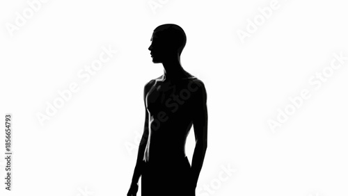 Silhouette of a person looking to the side against a white background.