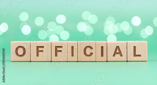 Wooden blocks spelling the word 'Official' on mint background