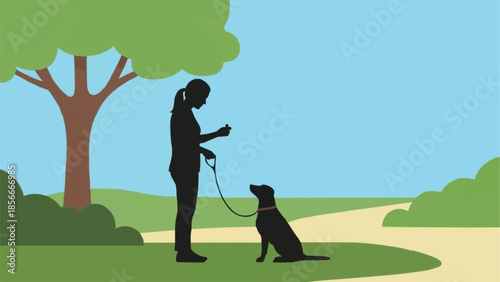 Woman training dog in park silhouette.