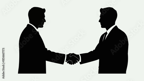 Two businessmen shaking hands in silhouette agreement concept.