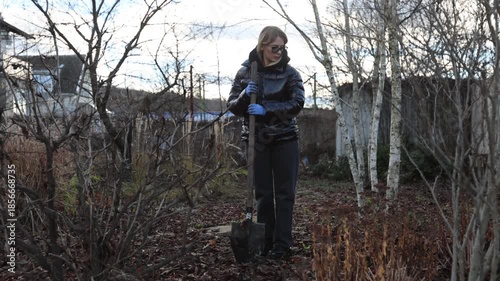 Lady gardening evening, Female gardener working in winter yard