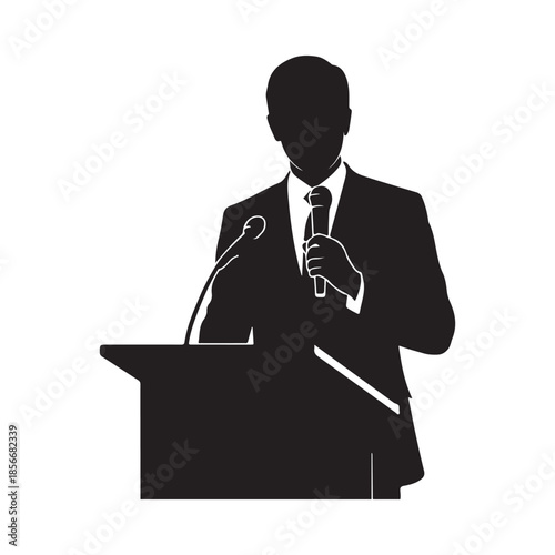 Silhouette of a man speaking at a podium with a microphone
