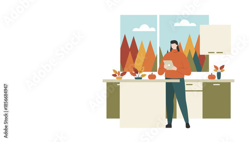 Woman uses tablet in a cozy kitchen decorated for autumn overlooking fall foliage