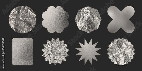 Silver foil stickers with metallic texture on dark background - chrome badge set in various shapes. Crumpled tag and label set of circles and flowers, stars and geometric forms with realistic shine