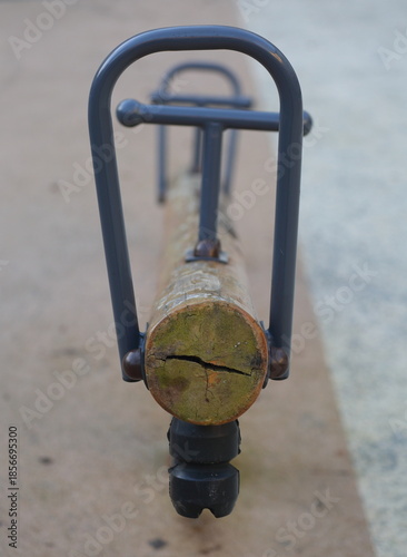 Children's swing made of logs and metal