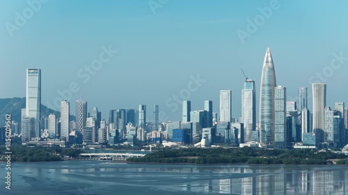 Drone fly over Shenzhen city central business district, aerial panorama China.  