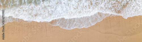 drone shot of a wave at the beach