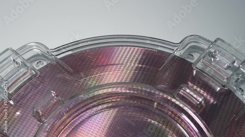 silicon wafers in a universal pod. Electronic circuit designs have been built onto the wafers using micromaching including photolithography