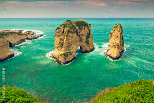 Dramatic surf around beautiful Pigeons' Rock (aka Rock of Raouche) right on side of Corniche, the main city's seaside promenade. Beirut, Lebanon