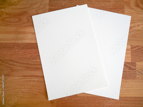 Blank Textured Paper Sheets on Wooden Table Background