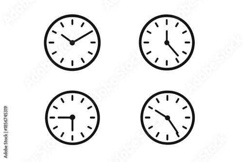 Four Clocks Displaying Different Times on a Dark Background