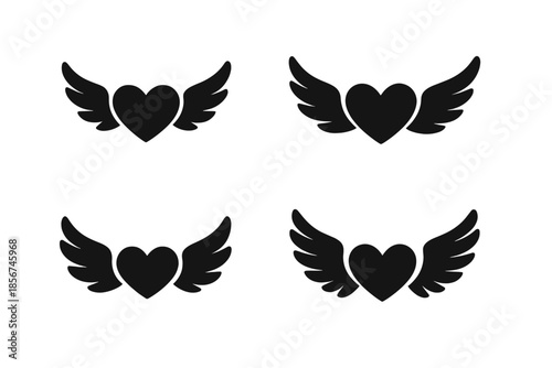 Four black winged hearts on a dark background