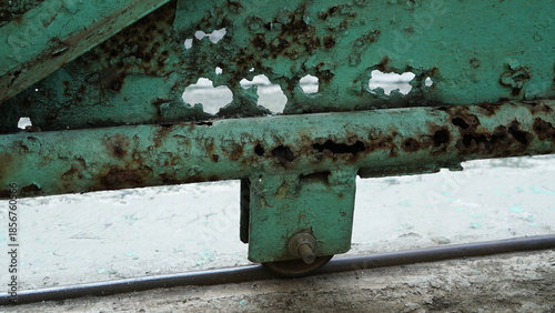 close-up of the rusty green gate wheel