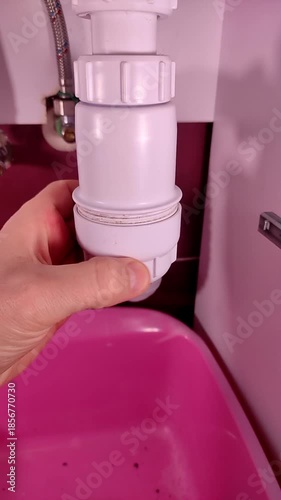 Plumber cleaning a clogged drain in the sewer