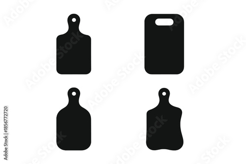 Four dark cutting boards on a gradient background