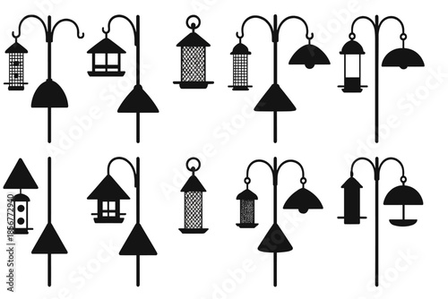 Dark Silhouettes of Bird Feeders and Lamps
