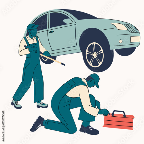 Two mechanics are diligently working on a light blue car one changing the tire and the other inspecting undercarriage