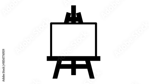 Blank Canvas on Painters Easel with Brushes.