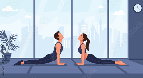 Young couple practicing yoga together in a modern studio, performing the upward-facing dog or cobra pose in sync.