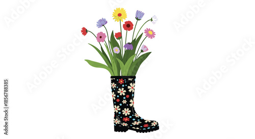 Black floral patterned rubber rain boot acting as a vase for a vibrant bouquet of colorful spring wildflowers and leaves.