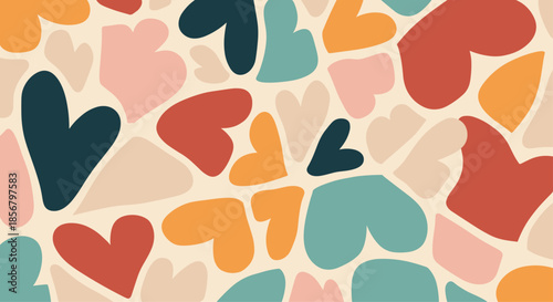 Colorful abstract heart pattern in various sizes and shades of orange, teal, and red for a playful romantic background.