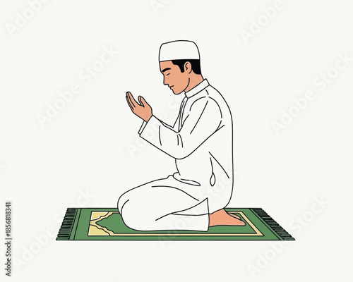 A muslim man is shown in a prayerful pose kneeling on a green prayer rug