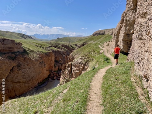 Boy hiking in Kok Kiya Canyon, Kyrgyzstan.