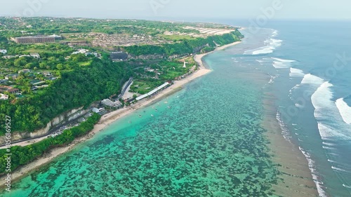 fpv drone flight over the white sand beach at sunset in bali
