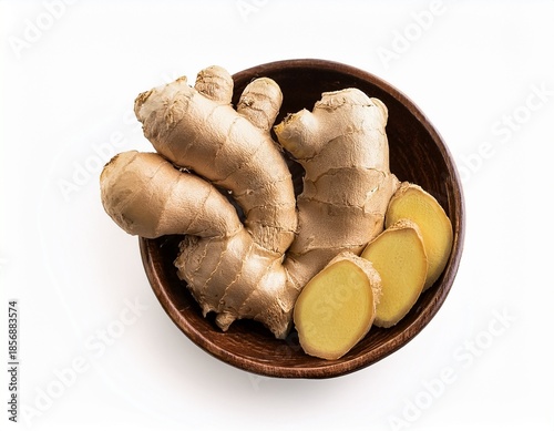 a bowl of ginger root with some of the ginger cut off