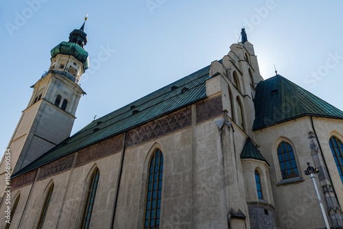 Historic European church with tower and green copper roof