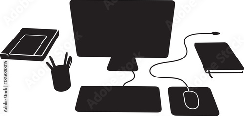 Modern computer setup with peripherals and office supplies nearby