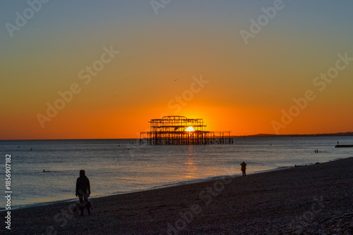 UK, Brighton, 03.01.2026: Burnt out Brighton Pier during sunset