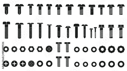 Arrangement of various black screws bolts and washers on a white background
