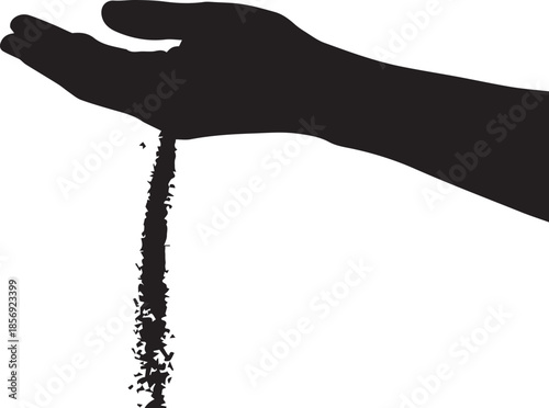 Sand slipping through fingers in black silhouette