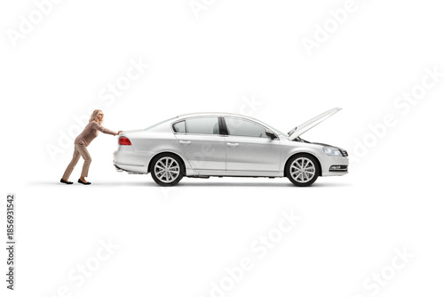 Fotografi Woman pushing a broken down car with an open hood