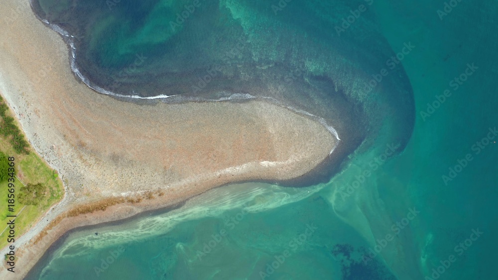 Fototapeta premium Aerial view of sandy shoreline and turquoise sea 