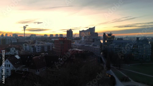 Aerial drone footage (ascent) over the skyline of Hamburg at sunrise