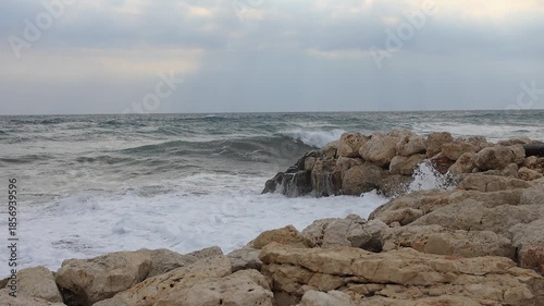 waves crashing on rocks near the sea 
