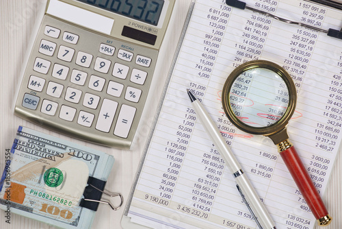 Accounting supplies arranged on an office desk. Top view.