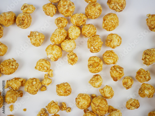 Wallpaper Mural Closeup top view of caramel popcorn balls filling the frame on white surface, detailed crunchy texture of sweet snack for packaging, posters and food background Torontodigital.ca