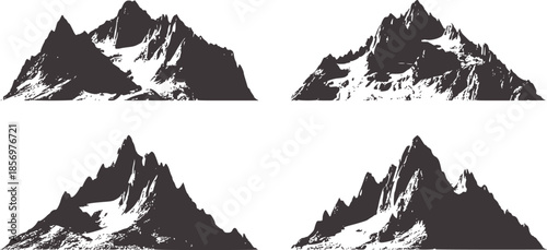 Four jagged snow capped mountain peaks black and