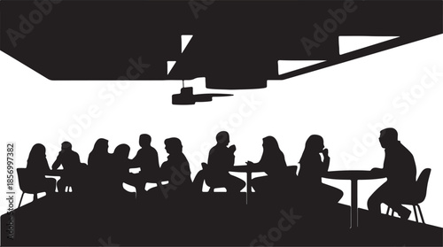 Many people are seated and socializing at tables within a crowded interior space