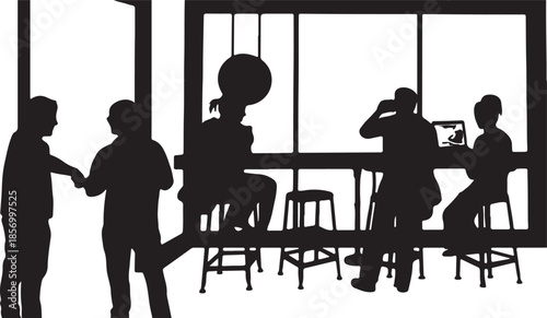 Several people talking and interacting while others focus on their devices in a busy indoor environment