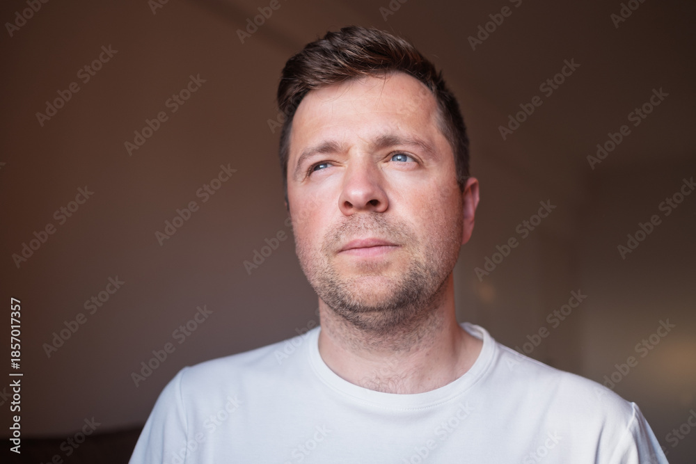 Fototapeta premium Young European Man Looking Aside Sadly